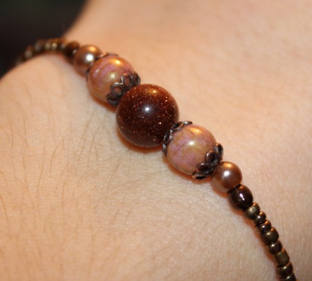 Bracelet fin marron doré 3 euros